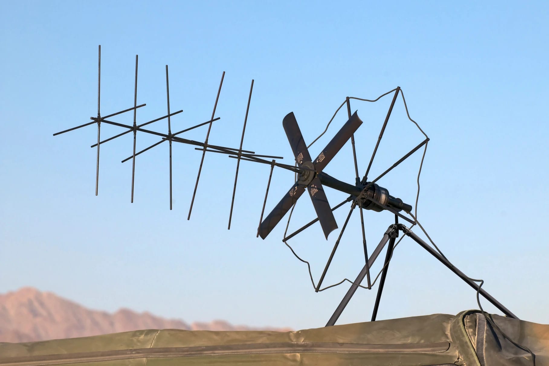 A photo of a communication antenna on a Rolatube tripod