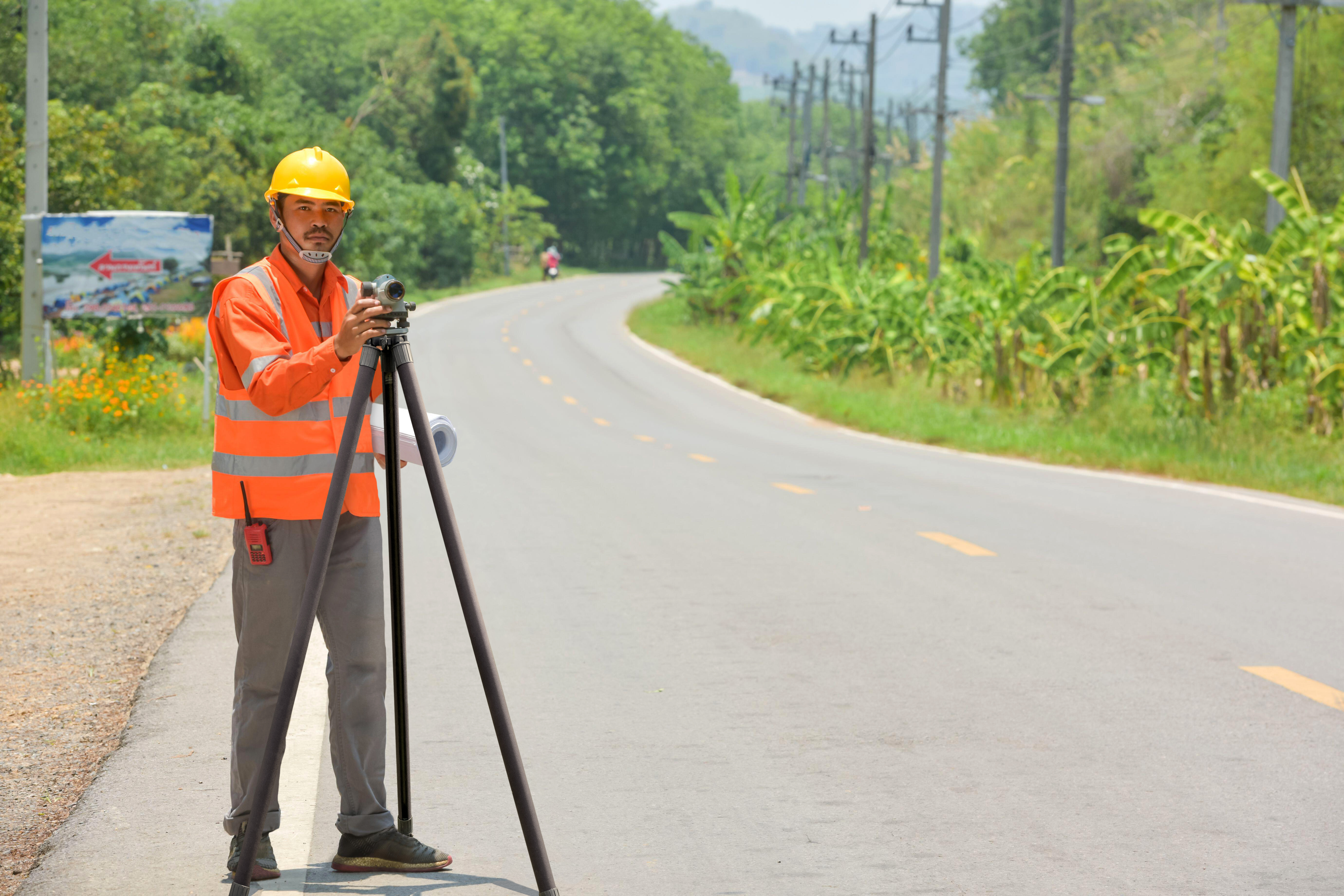 System 50 tripod in use for surveying on road