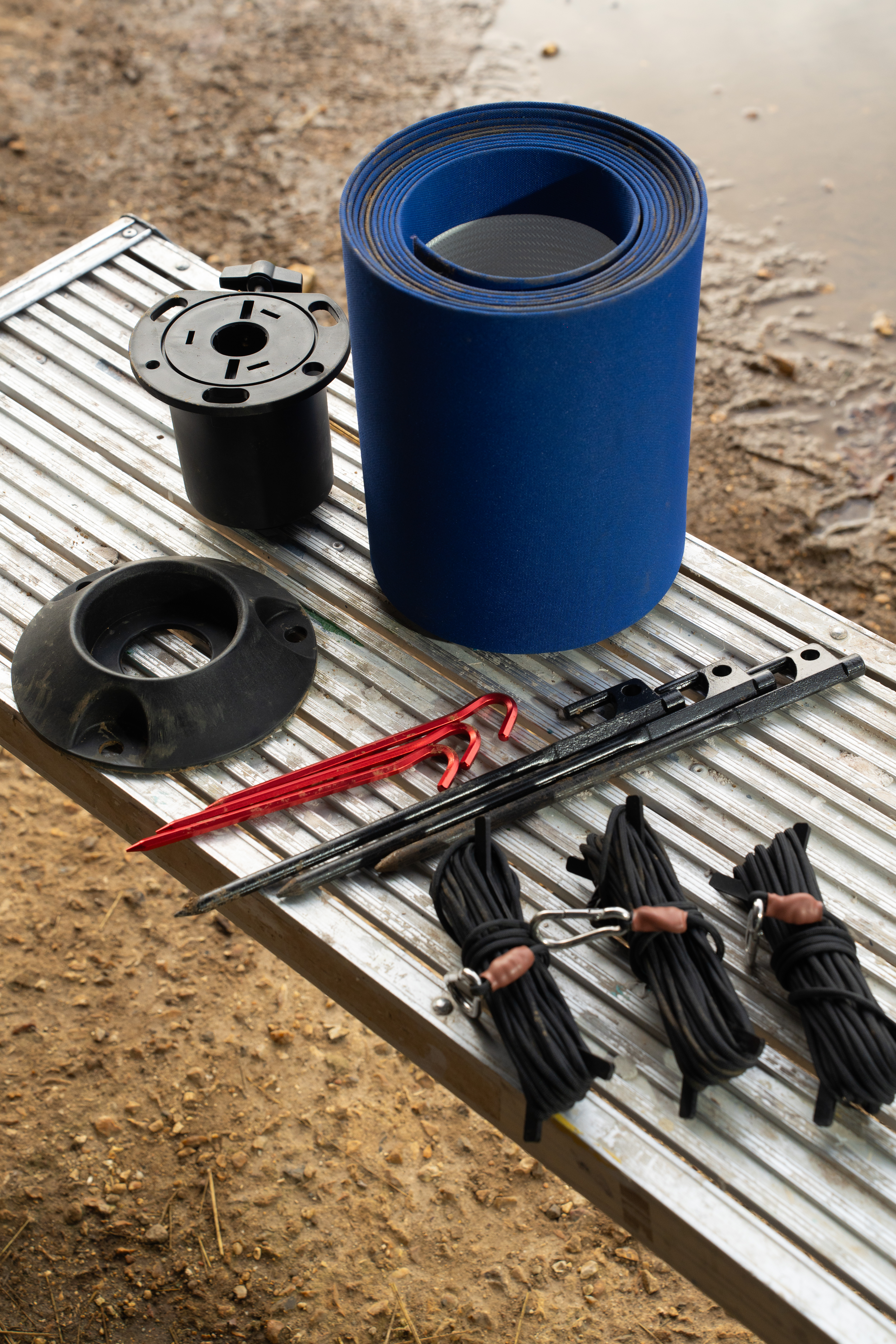 Rolatube mast system components — rolled BRC tube, base plate, guy ropes and ground stakes