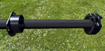 Close-up of the 3.5m IAM Mount assembly on grass