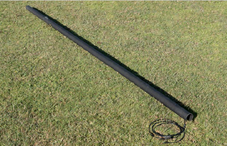 IAM unrolled on grass with cable extended