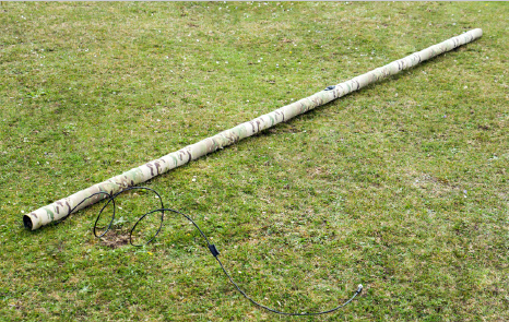 IAM unrolled on grass with cable extended