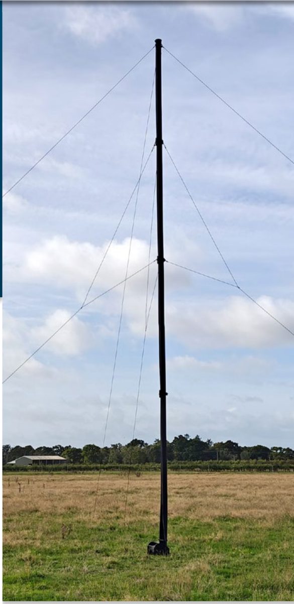 System 100 10m Mast fully deployed in field with guy ropes