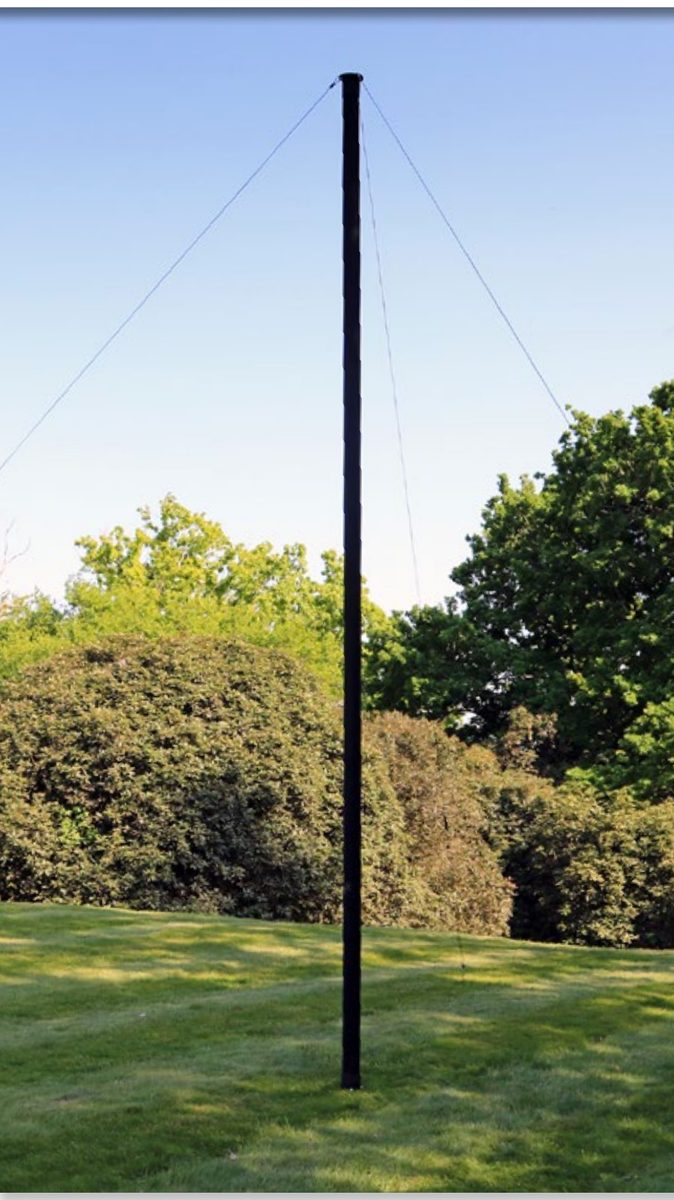 System 75 Single Tube Mast fully deployed and guyed in parkland